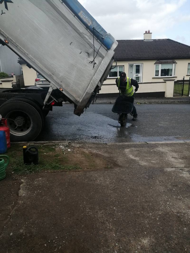 Ardnore: hot tarmac tipped from the lorry at the entrance