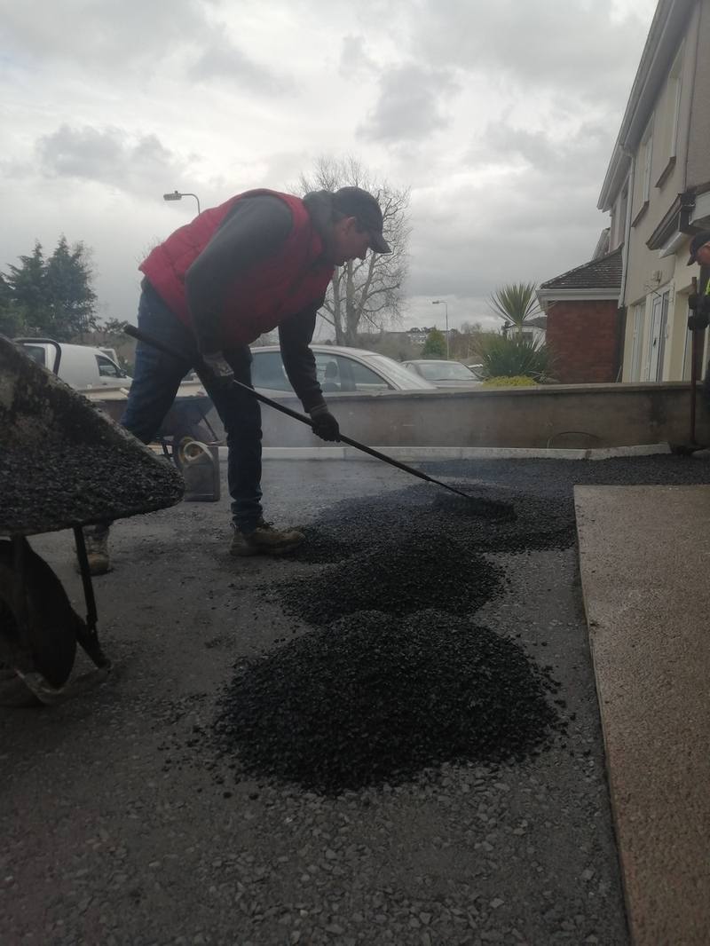 Ardnore: barrowing and raking tarmac into place