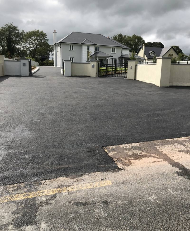 A clean joint where the new entrance meets the old road surface