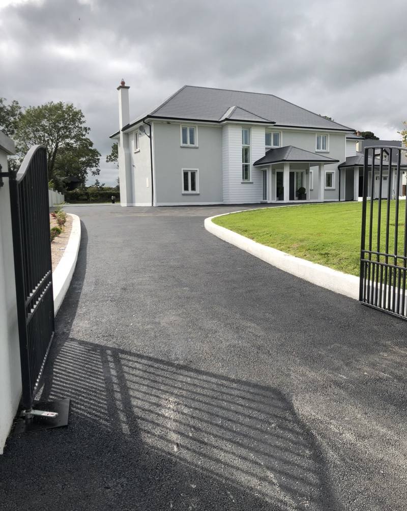 The same driveway from the gate, curving up to the house