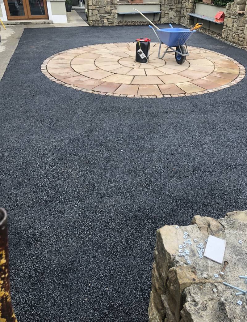 The tarmac yard and paved circle from the house side