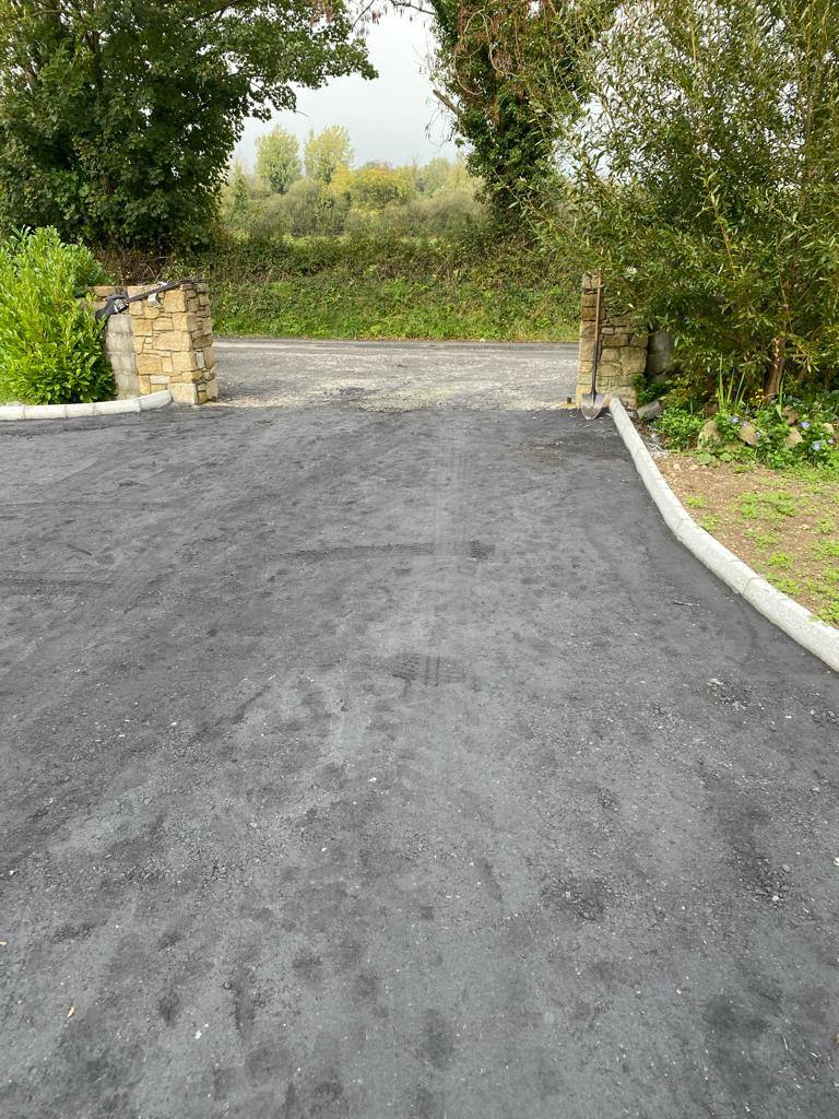 A new driveway in through a stone pier, kerbed both sides