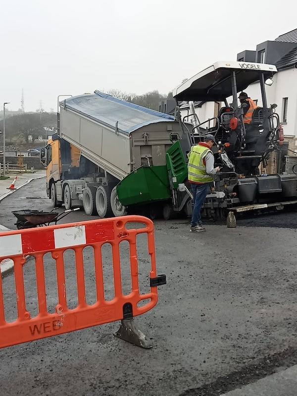Housing estate job: lorry and paver at the junction