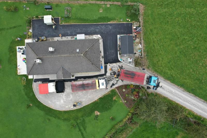 From the air: tarmac being laid around a house in the country