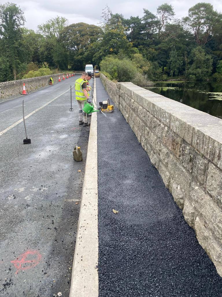 Footpaths job in Wicklow: laying along the bridge wall